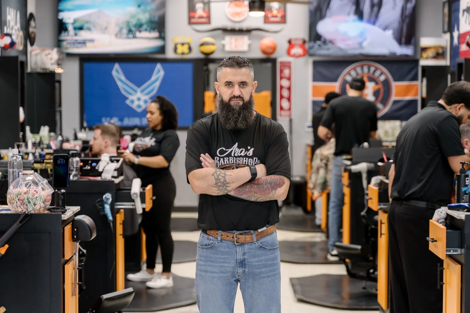 The owner of Aras Barbershop on the shop floor