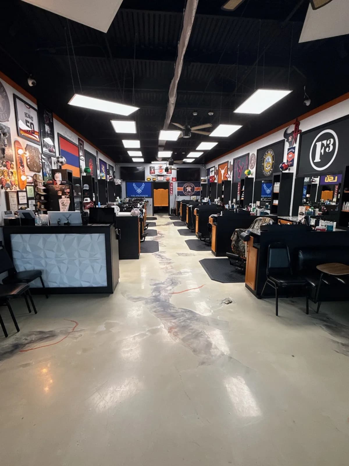 The Aras Barbershop floor, chairs, and stations